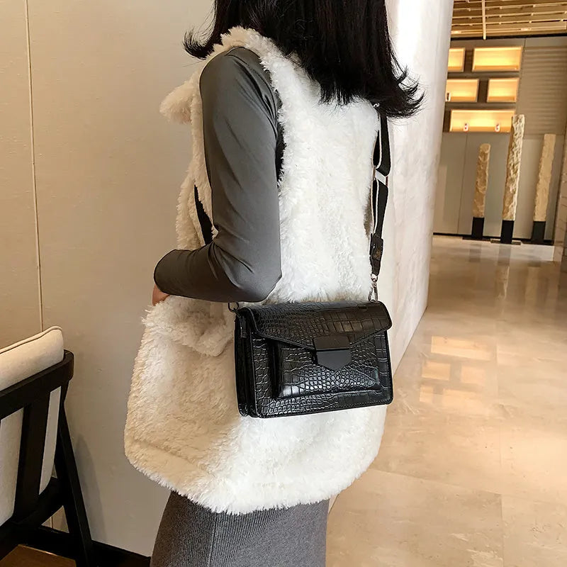Vintage-style women's crossbody bag in PU leather, shown in black, with adjustable strap.