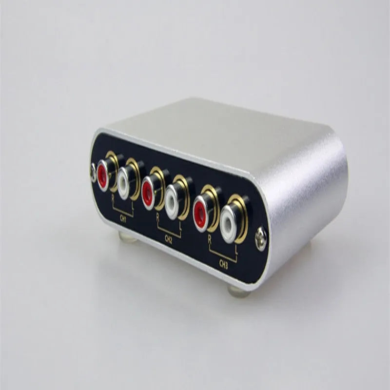 Silver audio source switch with infrared remote control and key switch on front panel, aluminium housing