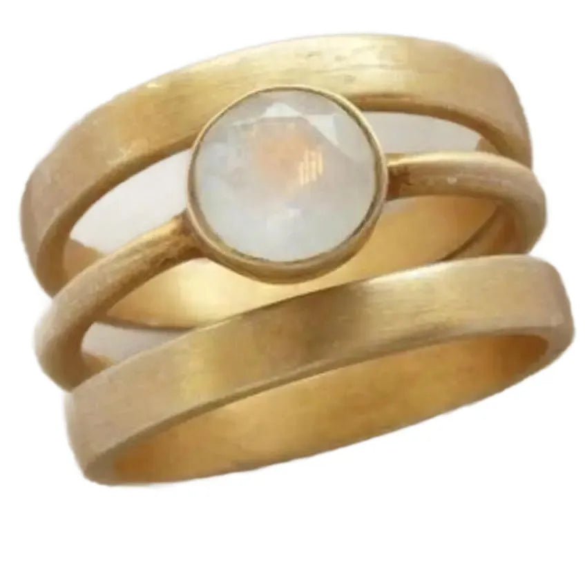Gold-plated geometric ring with hollow micro-inlaid white chalcedony gemstone and line pattern design