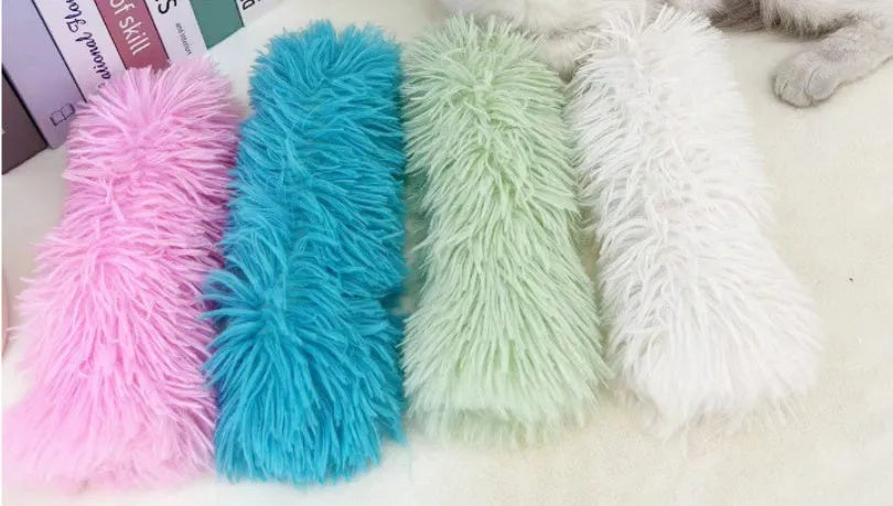 Blue, green, pink, and white cat plush toy pillow measuring 27 by 10 centimetres