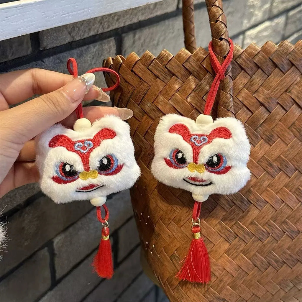 Blue and yellow Chinese lion plush keychain ornament with tassel and star stone details