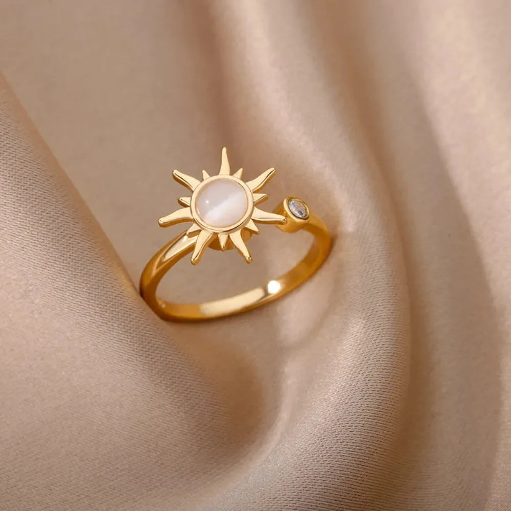 Simple geometric copper ring with adjustable opening and rotating mechanism in gold colour.