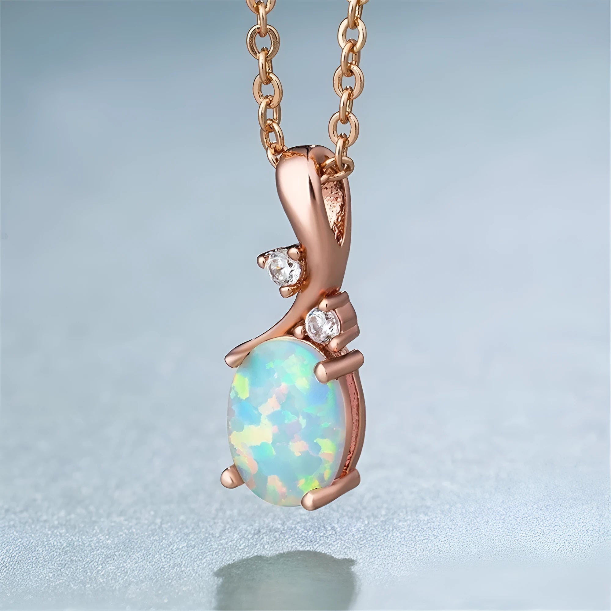 Water drop shaped opal pendant necklace on adjustable O-shaped alloy chain in rose gold finish