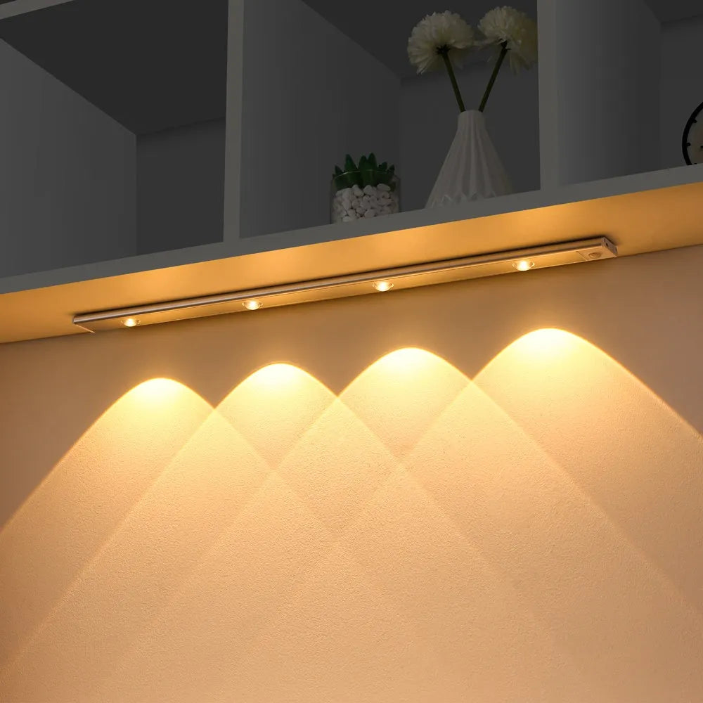 Ultra-thin USB LED night light with motion sensor in silver, aluminium body, 20 cm length, mounted inside a kitchen cabinet