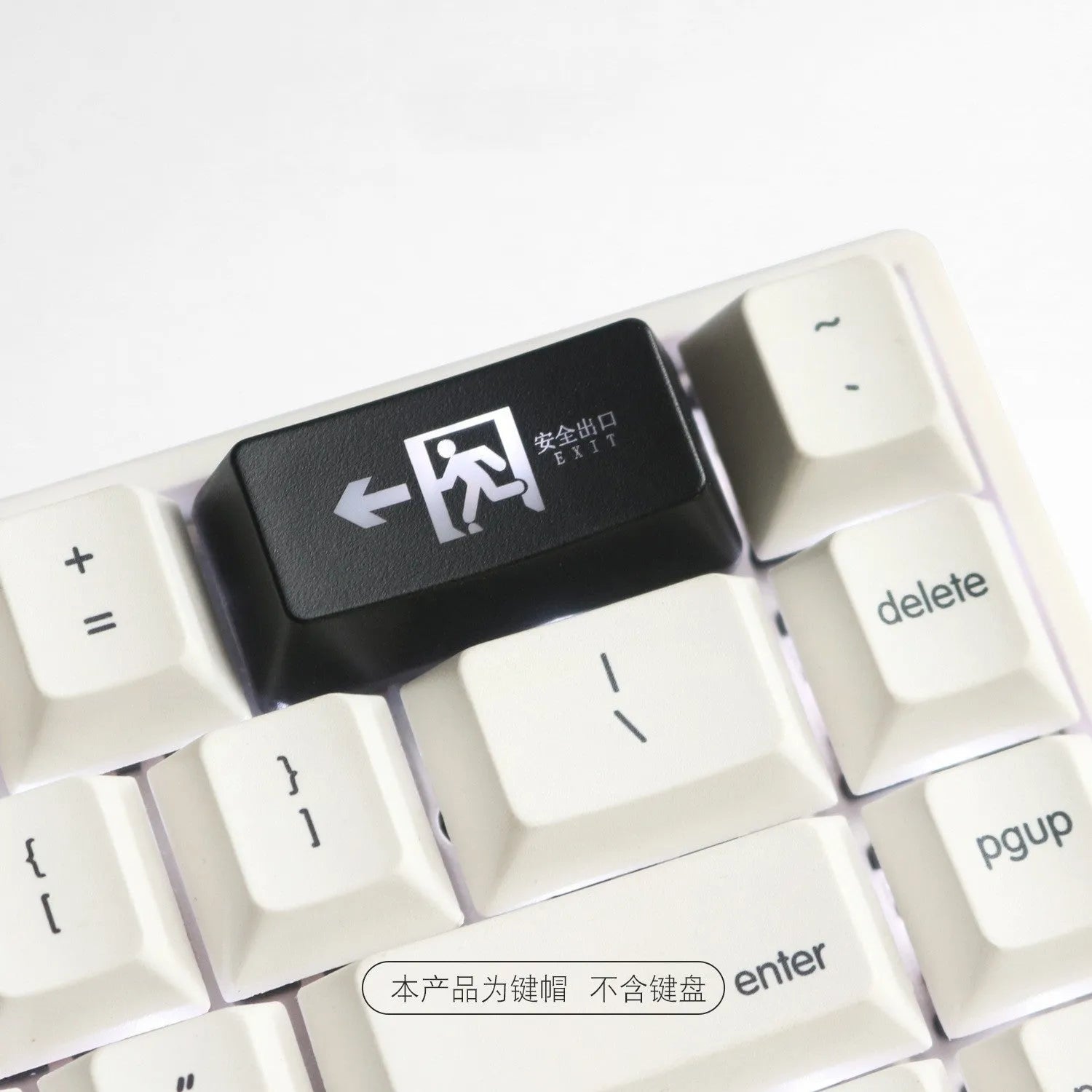 Red safety evacuation exit backspace key cap on a USB keyboard with transparent plastic construction