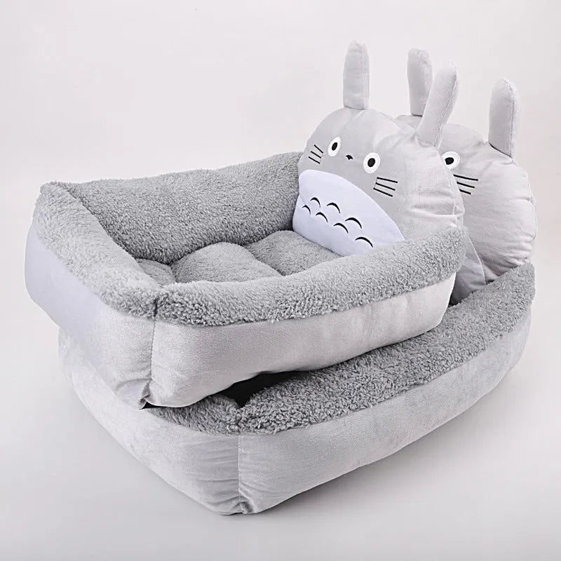 A blue cartoon-style sofa bed for a small dog or cat, with soft raised sides.