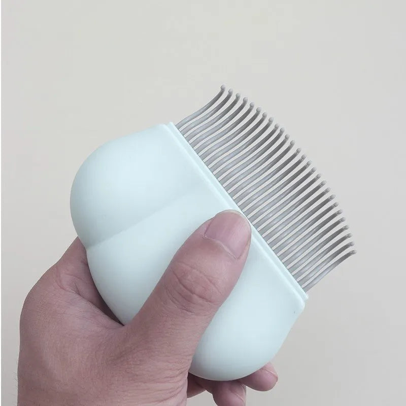 Paw Soft deshedding grooming brush for cats and dogs on a white background.