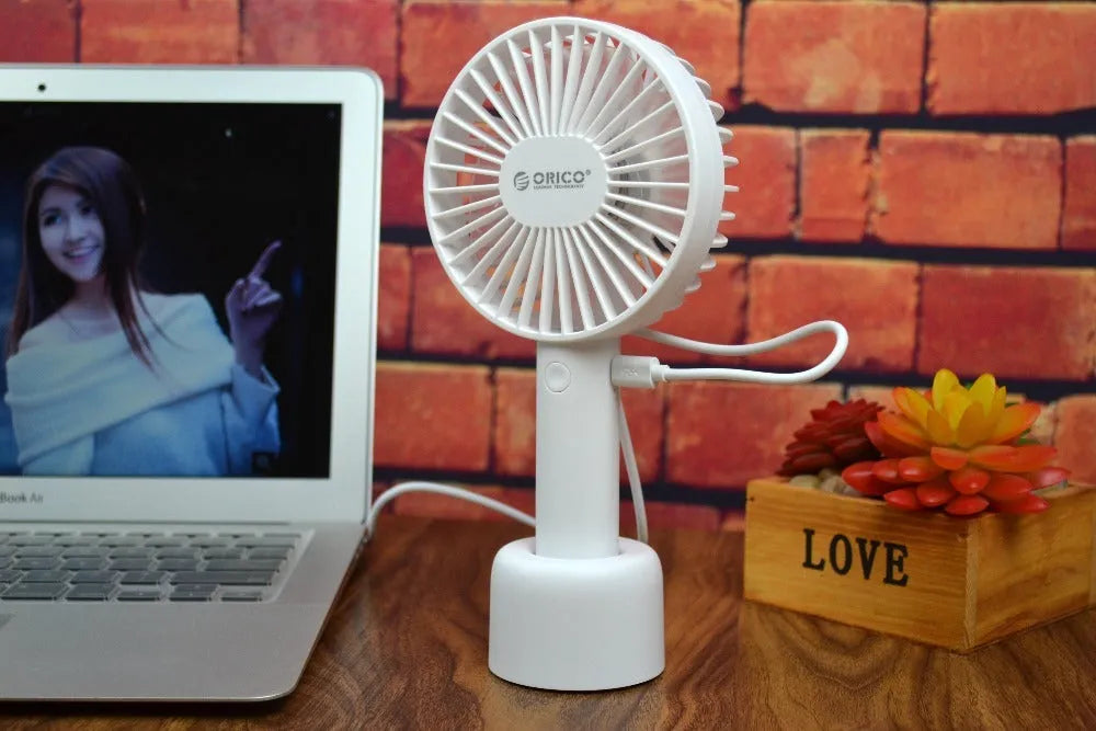 ORICO FH1 white portable USB desk fan with rechargeable battery shown on a desk