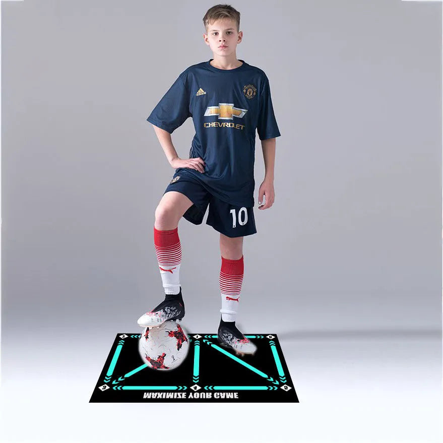 Black football training mat measuring 60x90cm on a flat surface