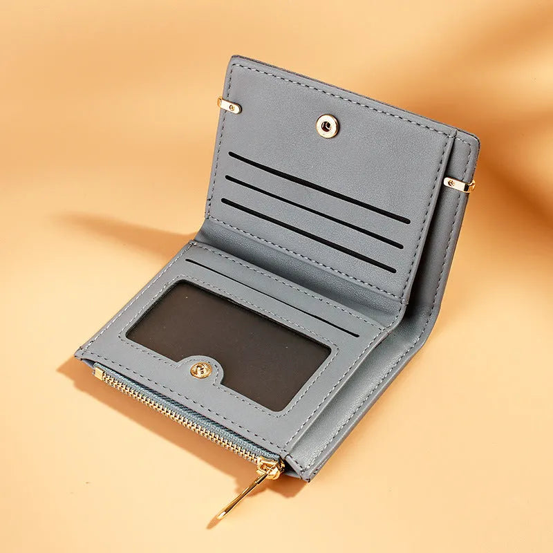 Short zipper ladies wallet in PU leather showing multiple internal card slots and compartments