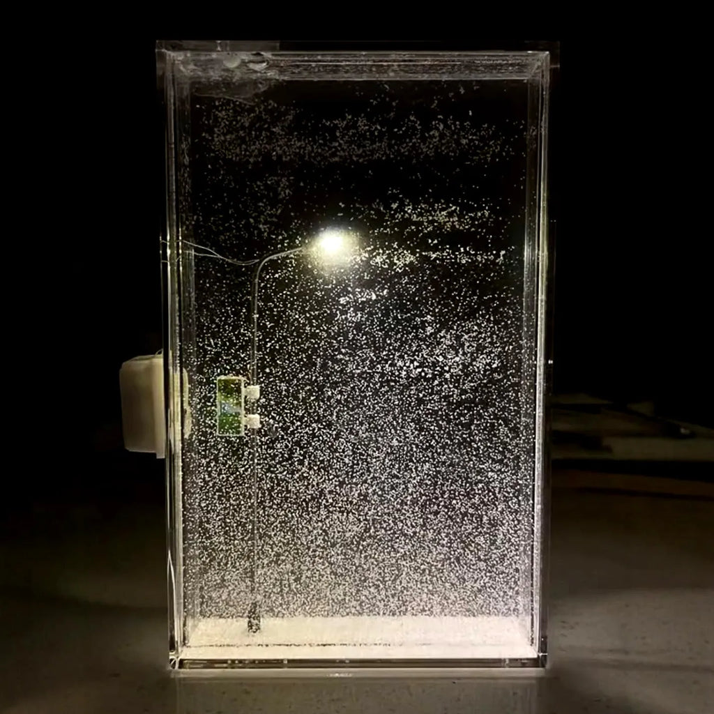 DIY snow night light kit showing materials for assembling a snowy landscape decorative light with LED effects