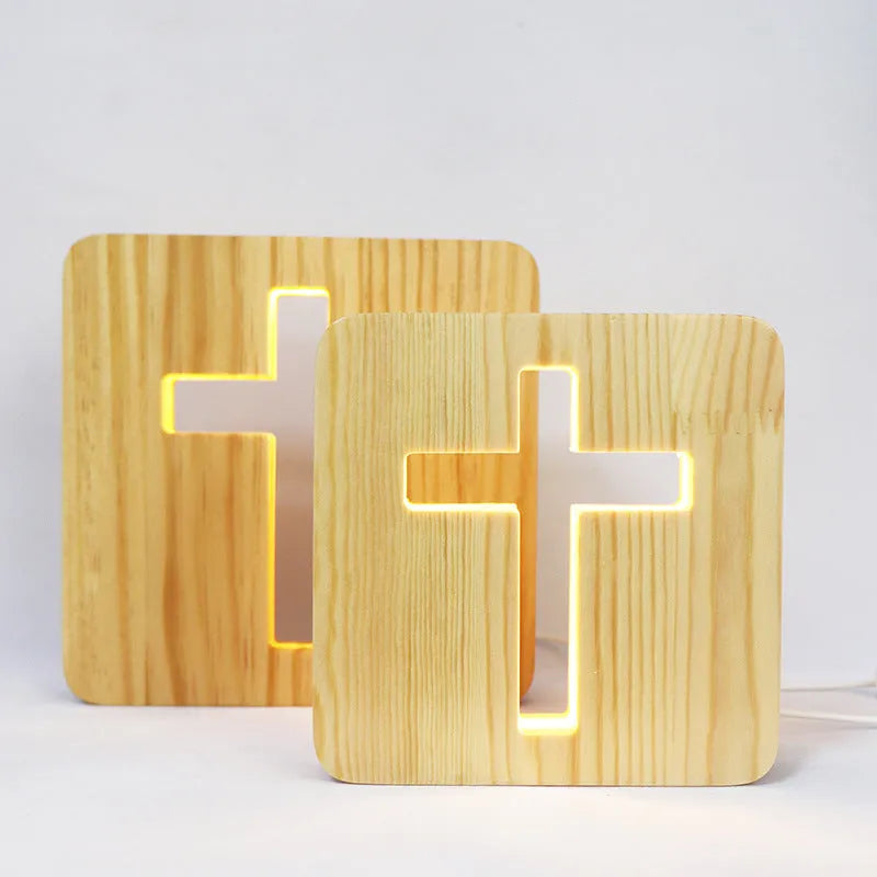 Solid wood hollow night lamp with warm white LED light, USB cable, and button switch on a wooden table