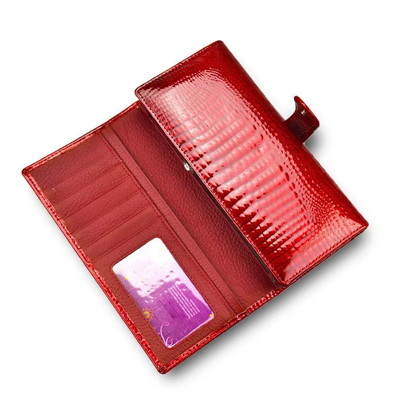 Red crocodile pattern patent leather women's coin purse with pigskin lining.