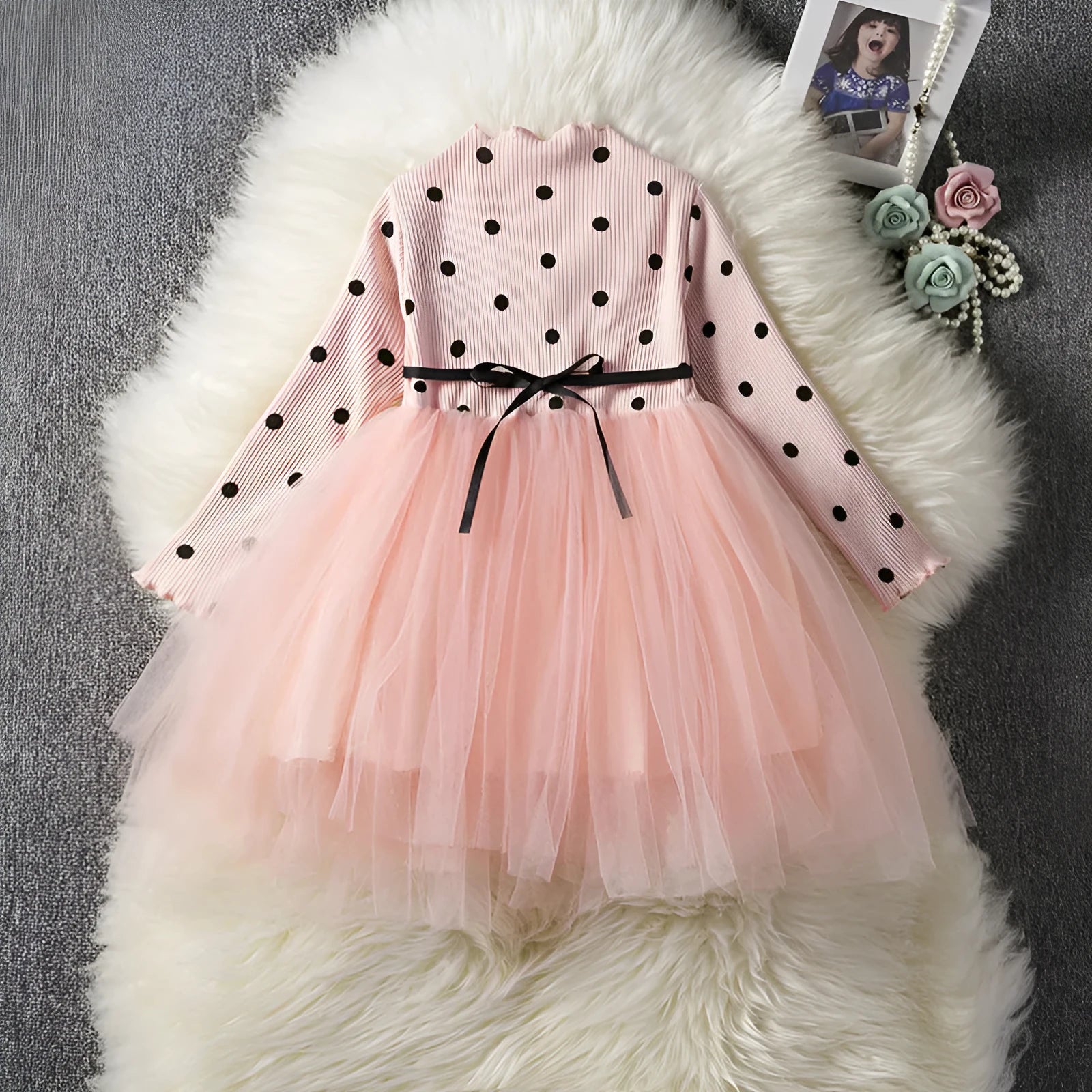 Baby girl wearing long sleeve lace tutu dress in pink for birthday party