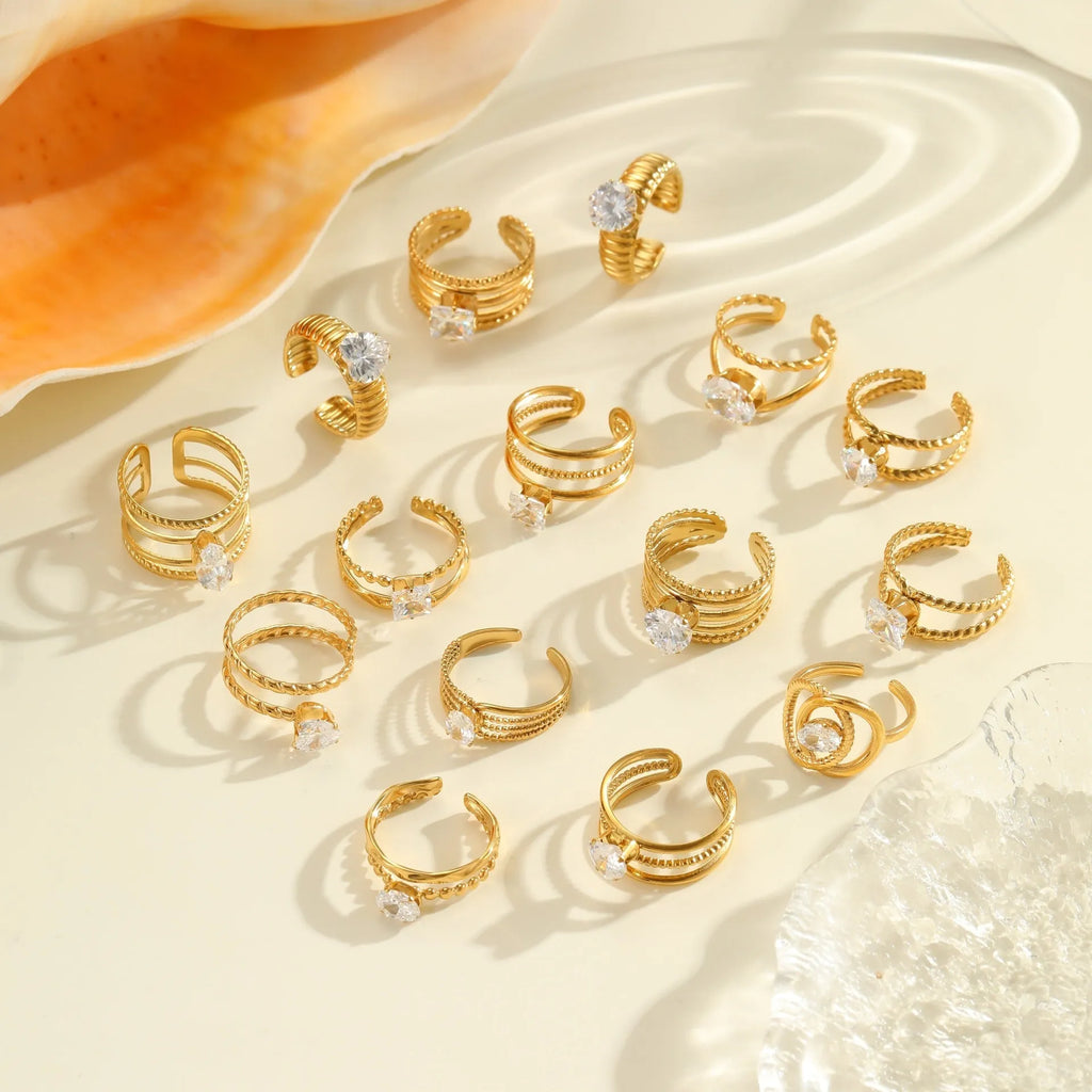 Women's gold stainless steel ring with zircon details on heart and drop shapes