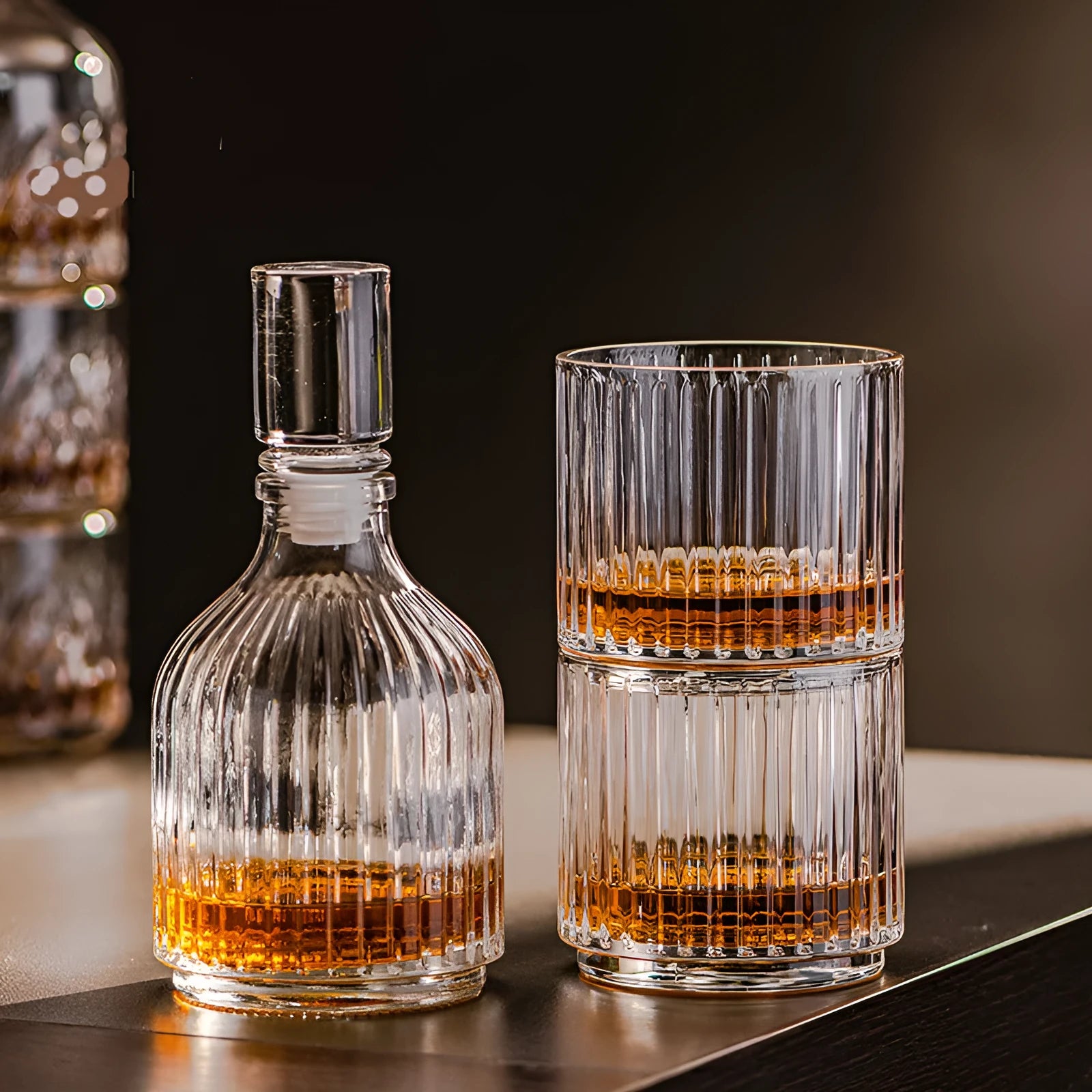 Clear glass cup and pot set with striped and diamond pattern designs for whiskey or wine