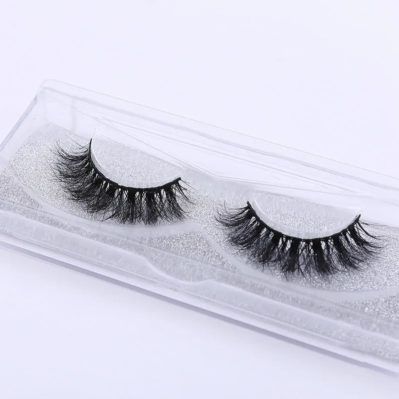 Handmade 3D mink full strip false eyelashes in style A01 against a white background