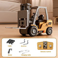 Miniature silver alloy remote control forklift model with black accents on a pallet.