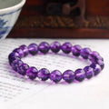 Handmade ametrine bracelet with detailed 128-cut crystal beads on wrist.