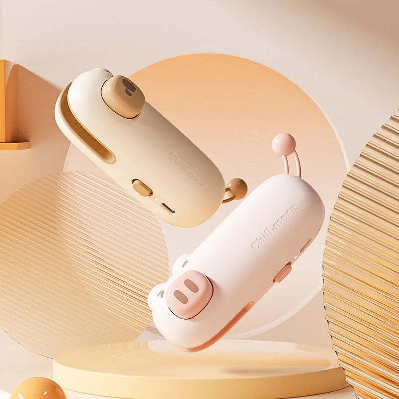 Mini rechargeable bag sealer in coffee bear design sealing a plastic snack bag on a table