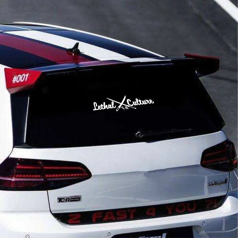 Yellow car rear windshield family sticker with letters and numbers on glass
