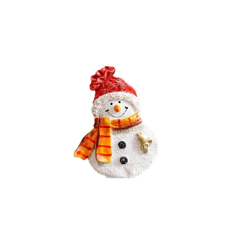 Small resin Christmas tree pendant ornament with a snowman figure holding a broom