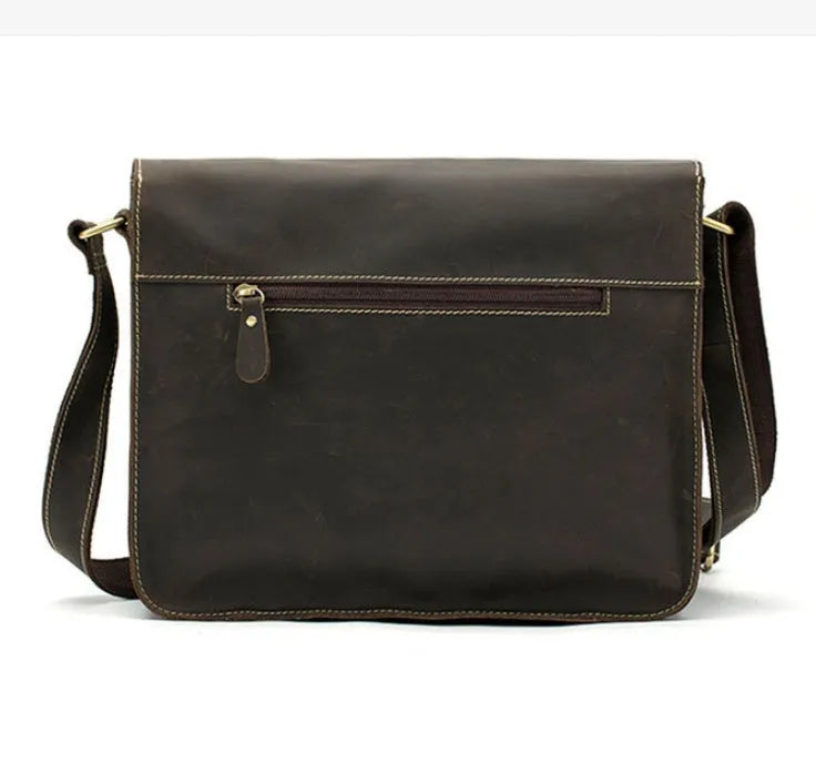 Vintage brown leather messenger bag with crossbody strap and front flap closure