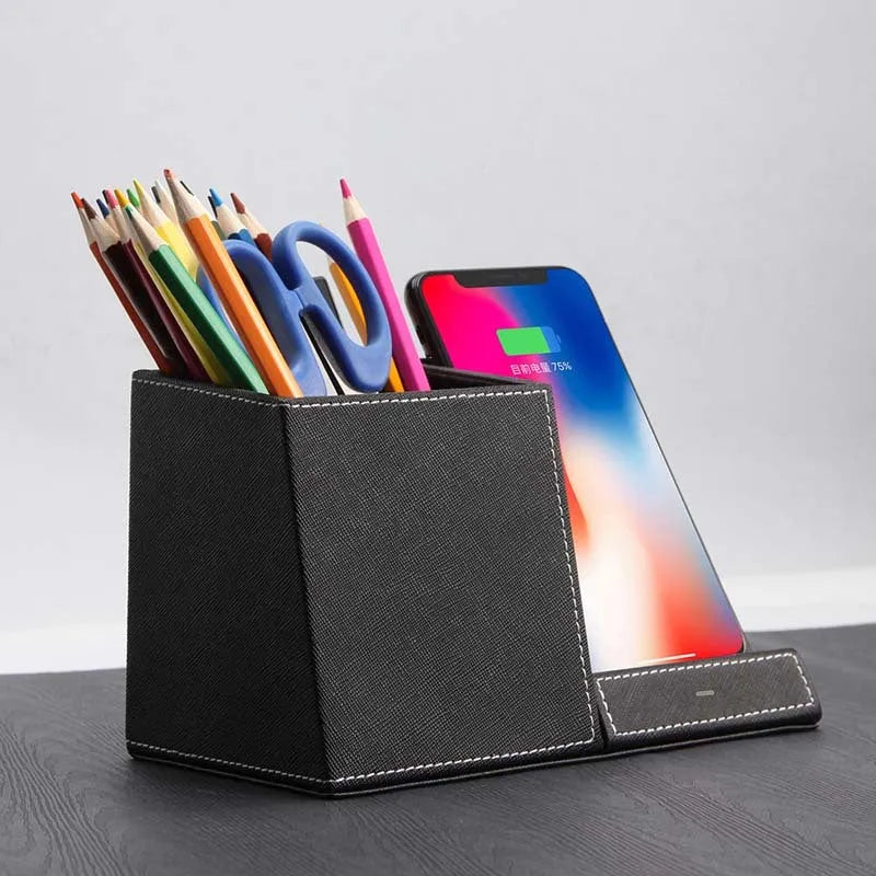 Leather pen holder wireless charger on desk with phone charging and pens organised
