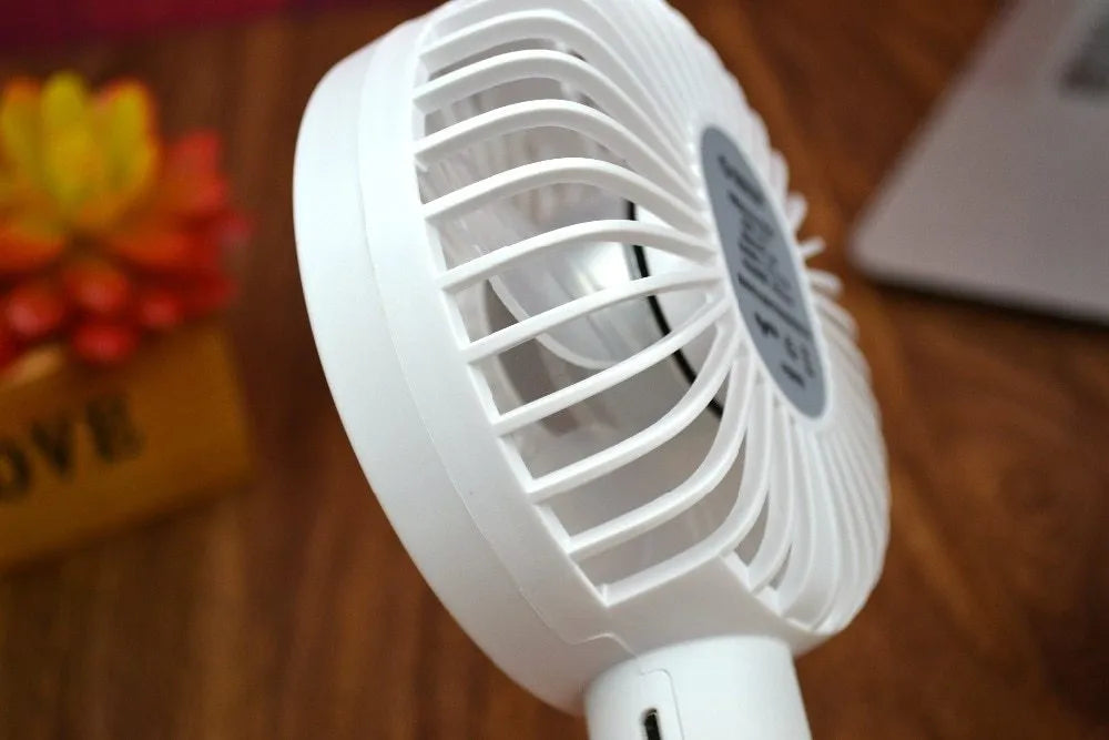 ORICO FH1 white portable USB desk fan with rechargeable battery shown on a desk