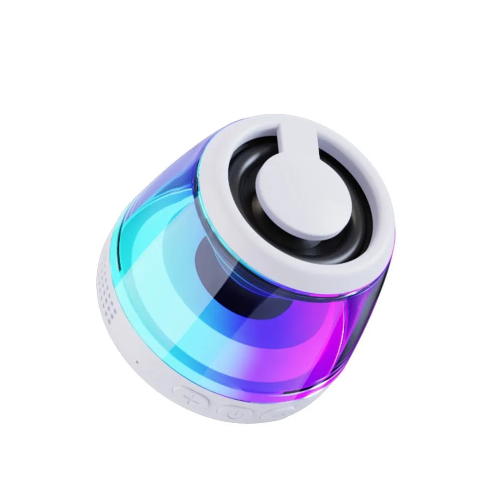 White portable Bluetooth speaker with LED ambience light and magnetic mini design on a desktop