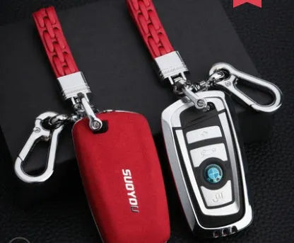 Suede key case with zinc alloy front frame in Classic Black, Charming Red, and Saddle Brown colour options