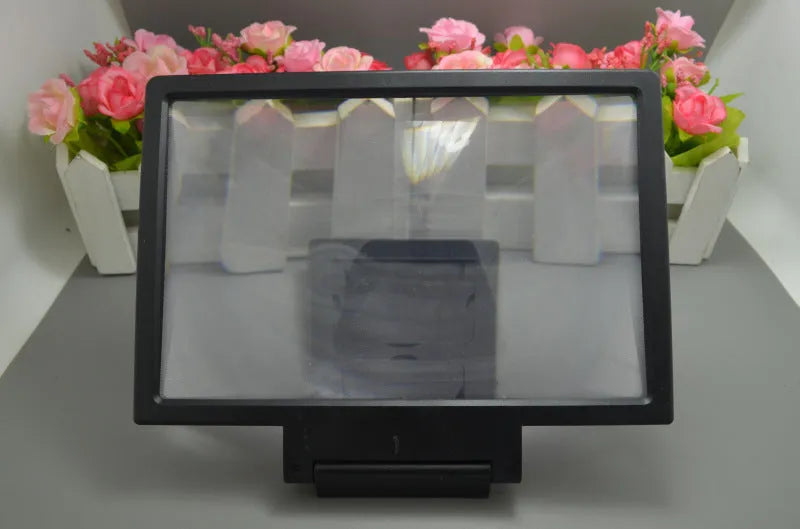 Portable 18cm screen amplifier for mobile phones and tablets, available in black or white, folded for travel