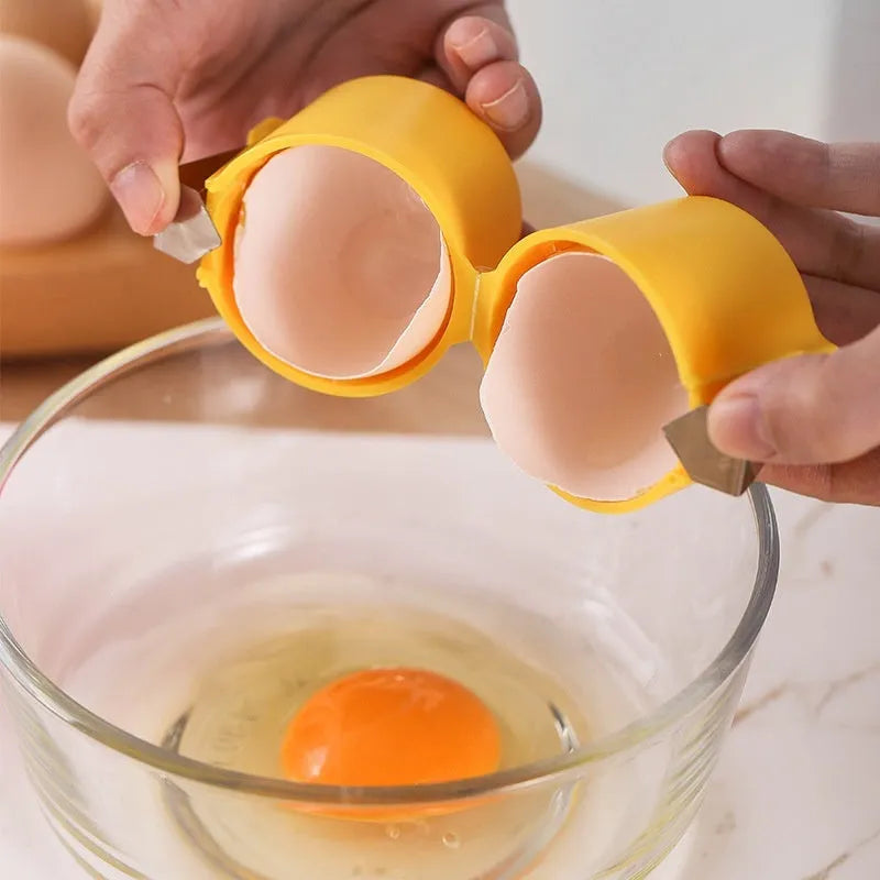Stainless steel egg shell opener in orange red with PP plastic handle on a kitchen counter