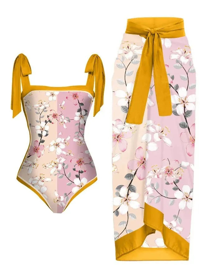 Women's floral printed two-piece swimsuit with matching skirt on a mannequin