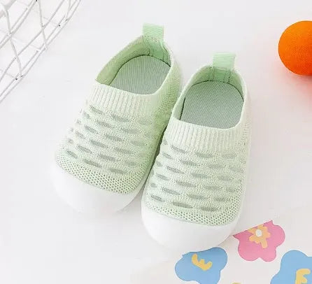 Baby soft sole non-slip walking shoes in cream yellow with fly woven cotton upper and natural rubber sole