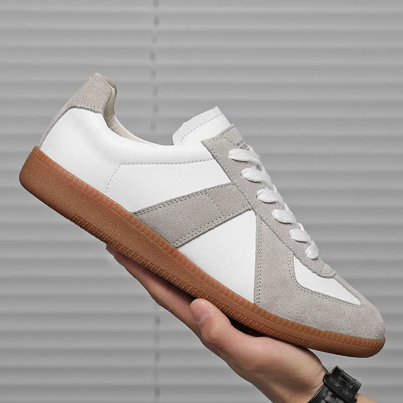 White Japanese-style retro unisex board shoes with mesh upper, rubber sole, and contrast stitching