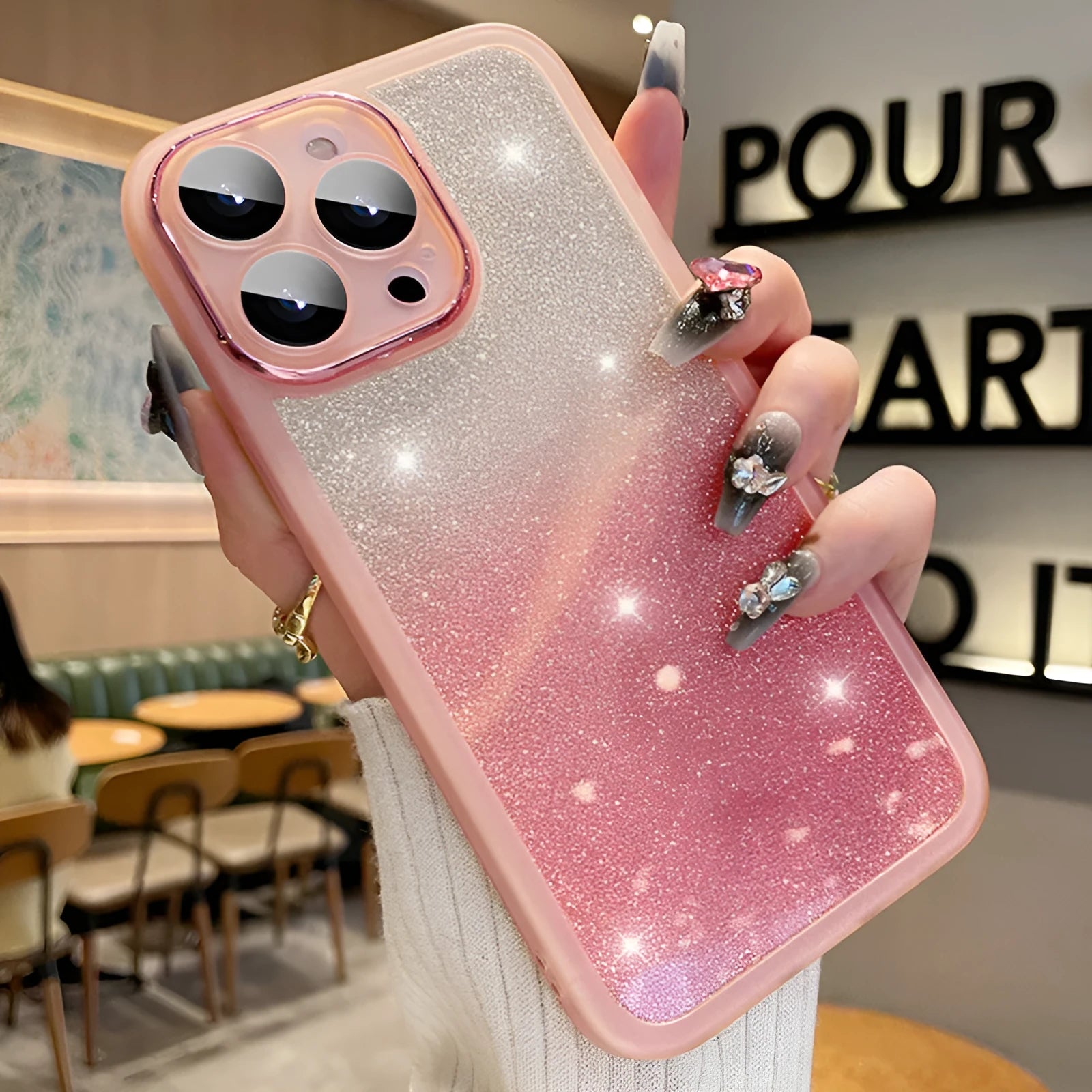 Ultra-thin transparent glitter iPhone case showing gradient pink and silver colours on a phone.