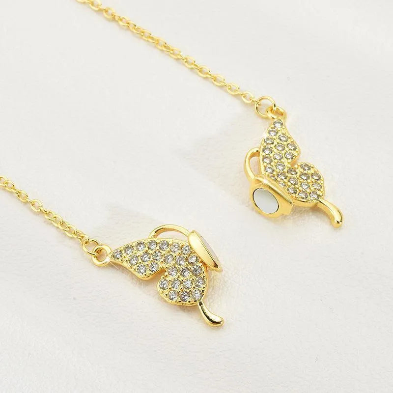 Gold titanium steel necklace with magnetic butterfly pendant on twisted chain