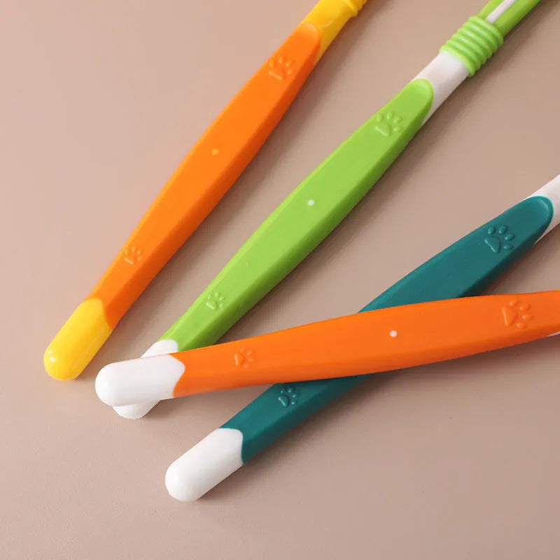 Pet toothbrush with plastic handle and nylon bristles in multiple colour options on sealed bag packaging