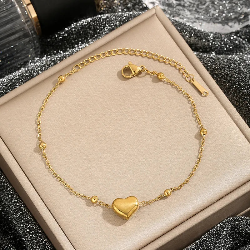 Women's titanium steel necklace with geometric pendant and ball bead chain in silver finish on white background