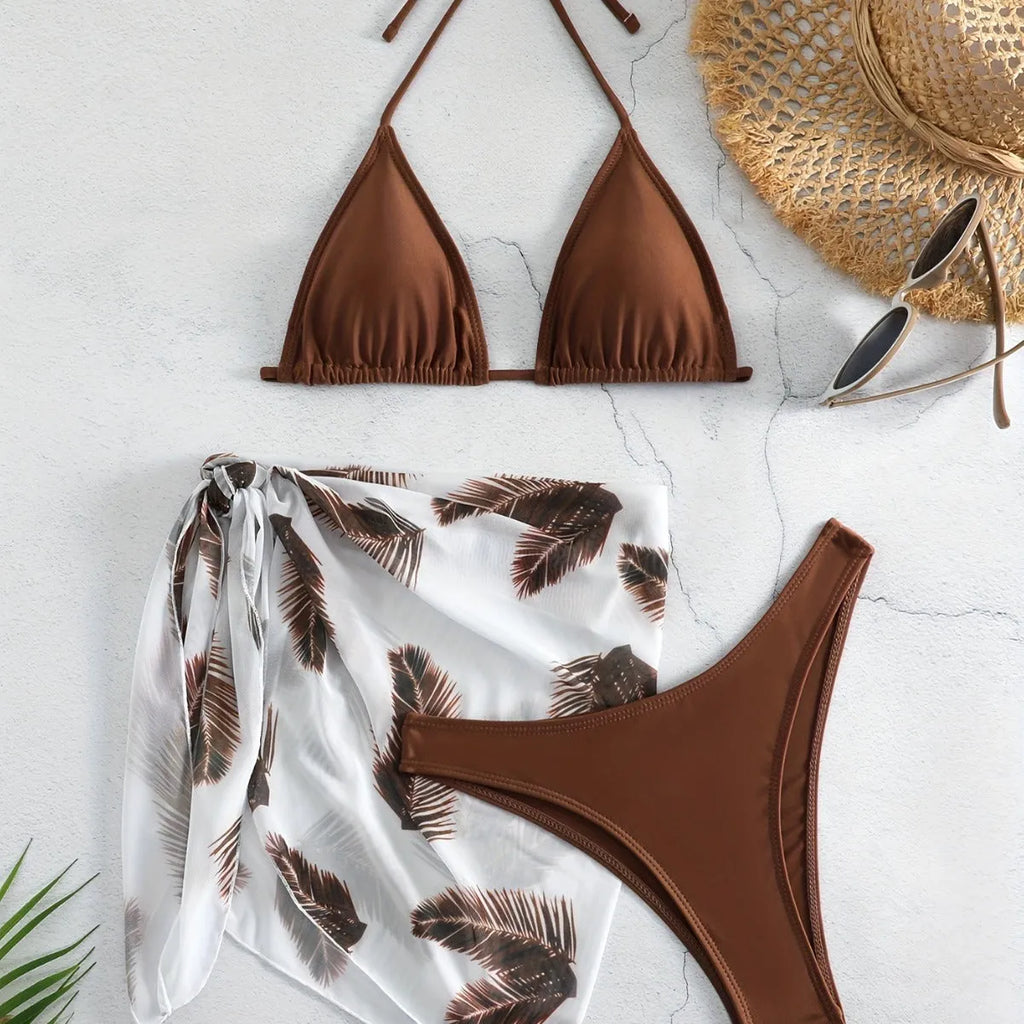Three-piece bikini swimsuit set with printed gauze skirt in solid colour polyester, available in eight colours sizes XS to XL