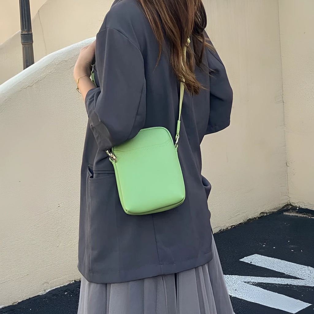 Solid colour PU leather small crossbody phone bag measuring 14.5cm by 5.5cm by 19cm