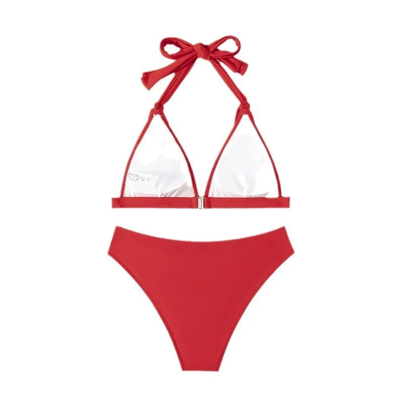 Red women's lace-up halterneck bikini with split design and matching shorts