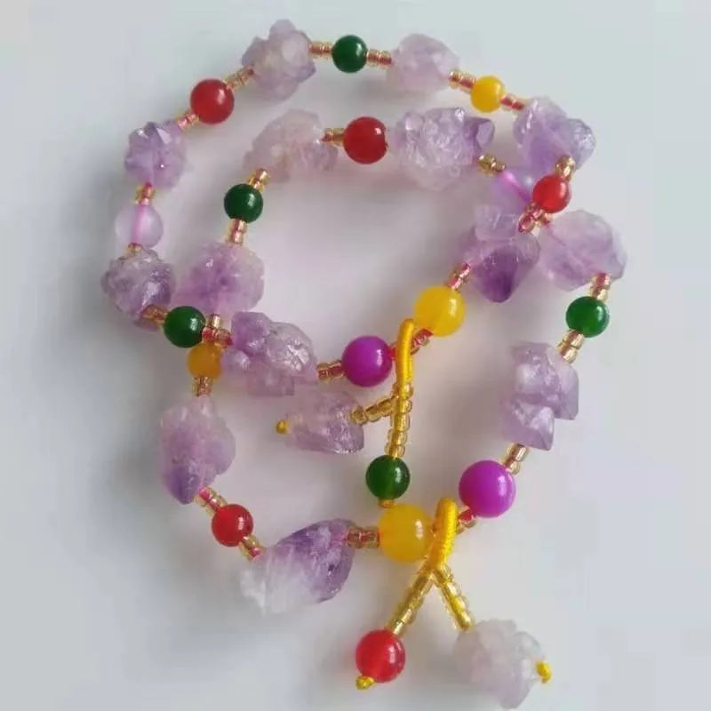 Natural shaped amethyst bead bracelet for women with a fu character charm.