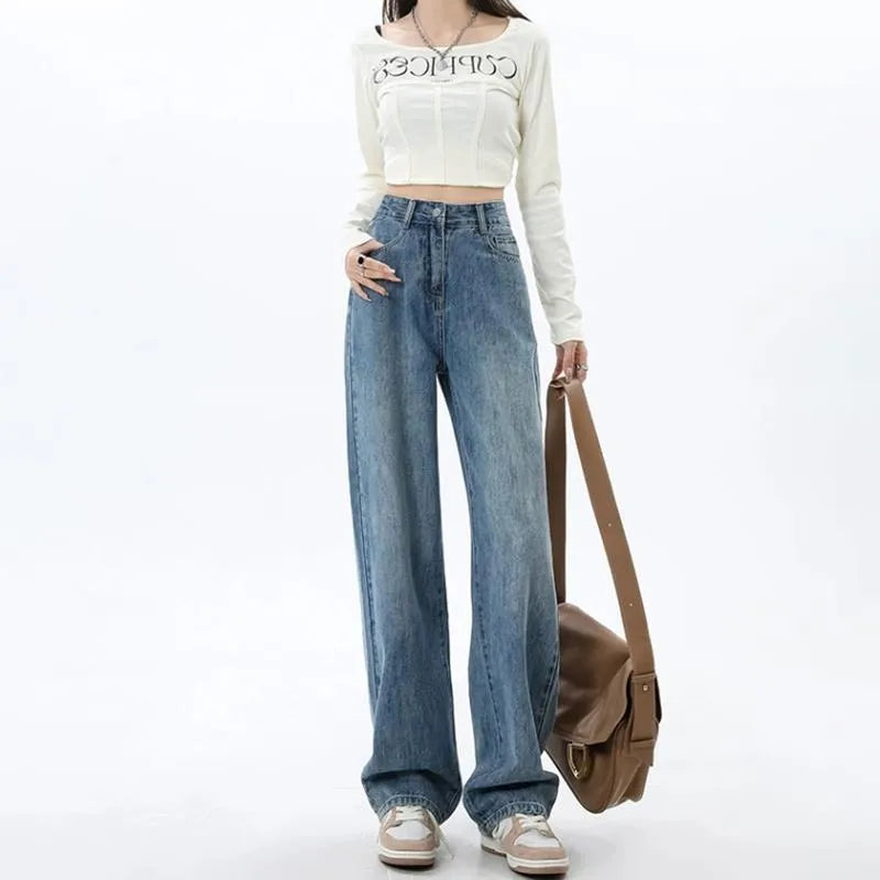 Women's retro blue wide leg jeans with high waist and straight leg design on denim background