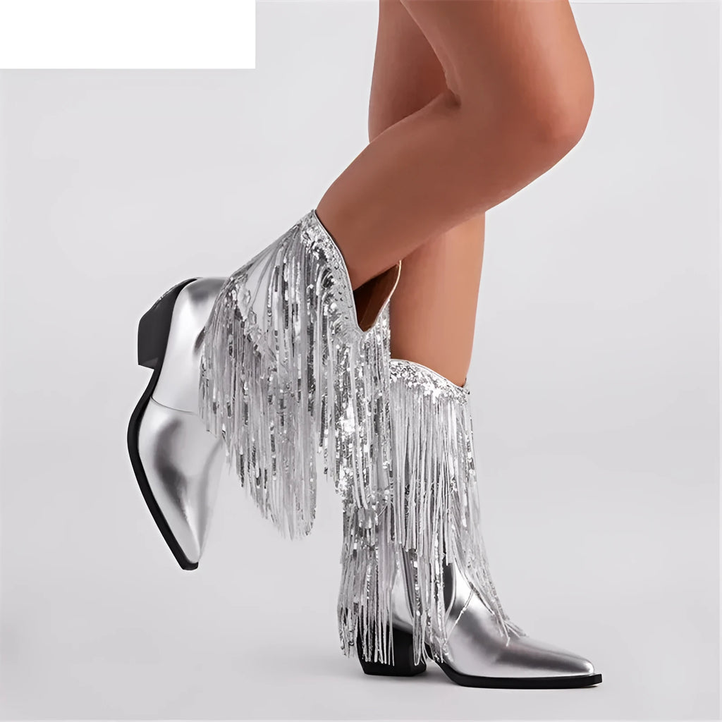 Women's black chunky heel tassel ankle boots with a pointed toe and super high stiletto heel.
