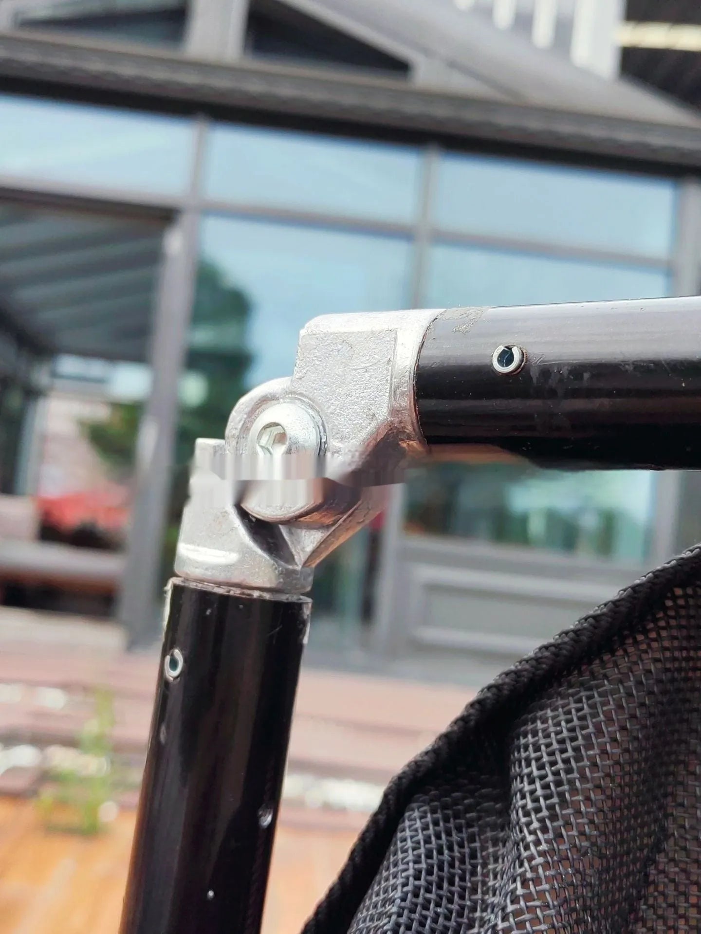 Large black aluminium alloy pet stretcher shown in a folded storage configuration.