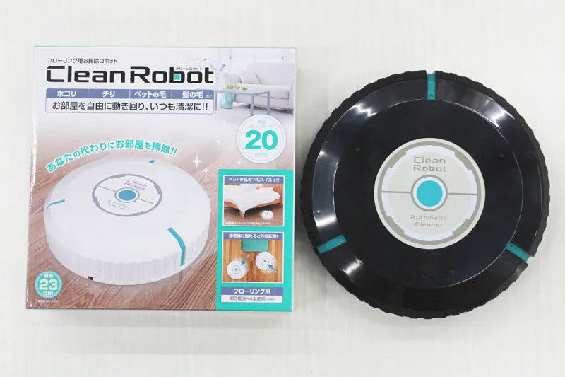 Black and white ABS robot vacuum cleaner on a wooden floor