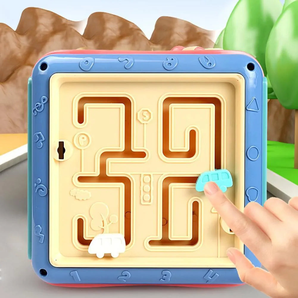 Six-sided educational cube toy with multiple activity panels including bead maze and shape puzzles