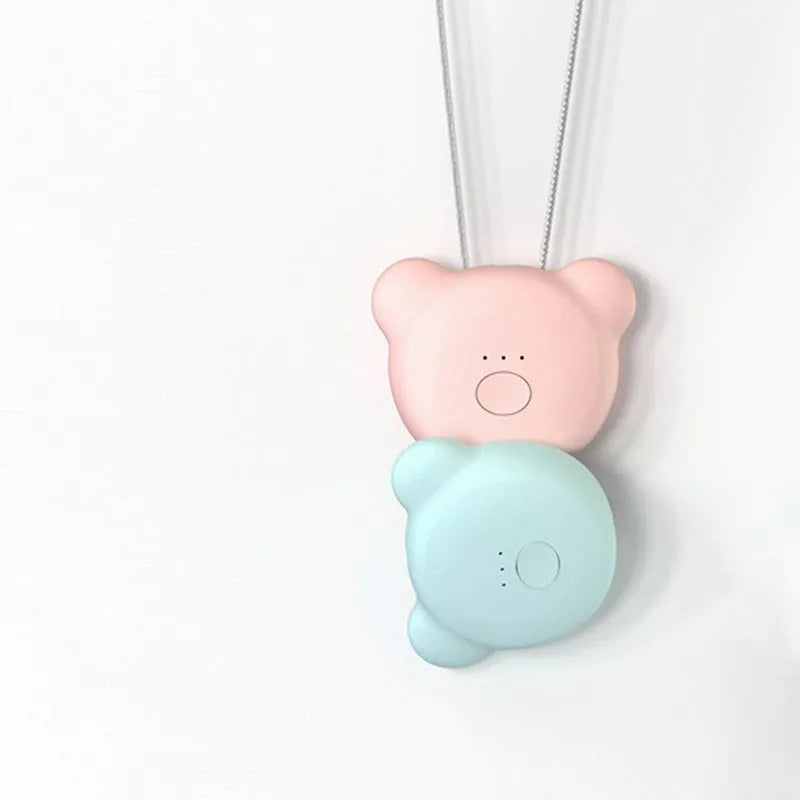Mini USB rechargeable wearable air purifier necklace in pink, showing compact dimensions.
